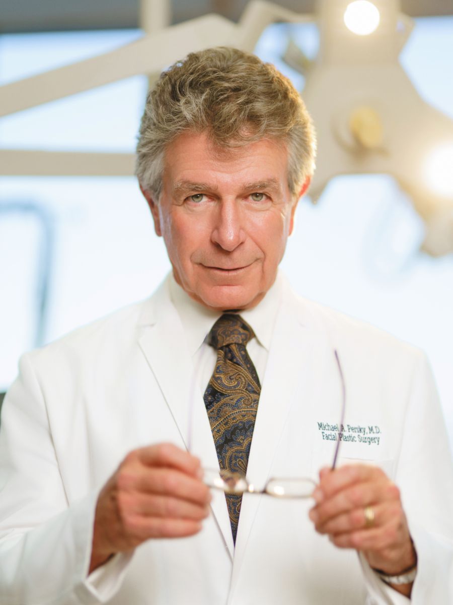 Michael A. Persky, MD wearing white lab coat