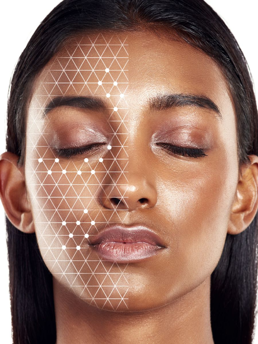 woman with dotted grid on the left side of her face